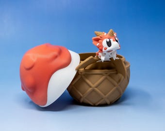 May include: A small, red and white dragon figurine with black eyes peeks out of a brown waffle cone-shaped container with a red and white lid.