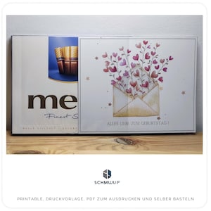 Könnte beinhalten: Eine druckbare Karte mit weißem Hintergrund und einer Aquarell-Illustration eines rosafarbenen Umschlags mit rosafarbenen Herzen und Blumen. Der Text "ALLES LIEBE ZUM GEBURTSTAG!" ist auf der Karte gedruckt. Die Karte ist Teil eines druckbaren Sets zum Basteln.