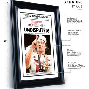 May include: A framed newspaper front page from The Indianapolis Star, commemorating a sports victory. The black frame measures 17 inches wide and 23 inches tall. The headline reads "UNDISPUTED!" with a photo of a player holding a trophy.