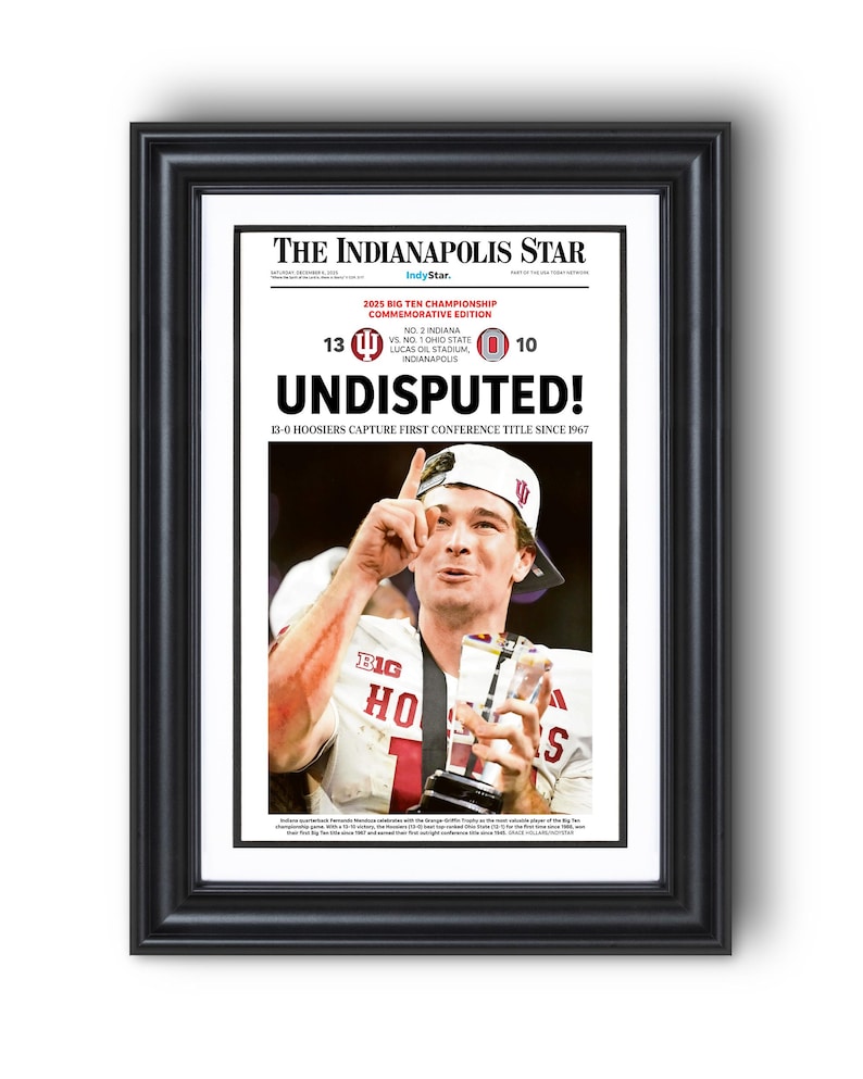May include: Framed newspaper front page from The Indianapolis Star, commemorating the 2025 Big Ten Championship. Headline: "UNDISPUTED!" with a photo of a player holding a trophy. The score is 13-0, with the text "13-0 Hoosiers capture first conference title since 1967."