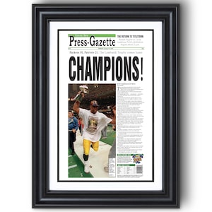 1997 Green Bay Packers Super Bowl “CHAMPIONS!” Framed Newspaper Print