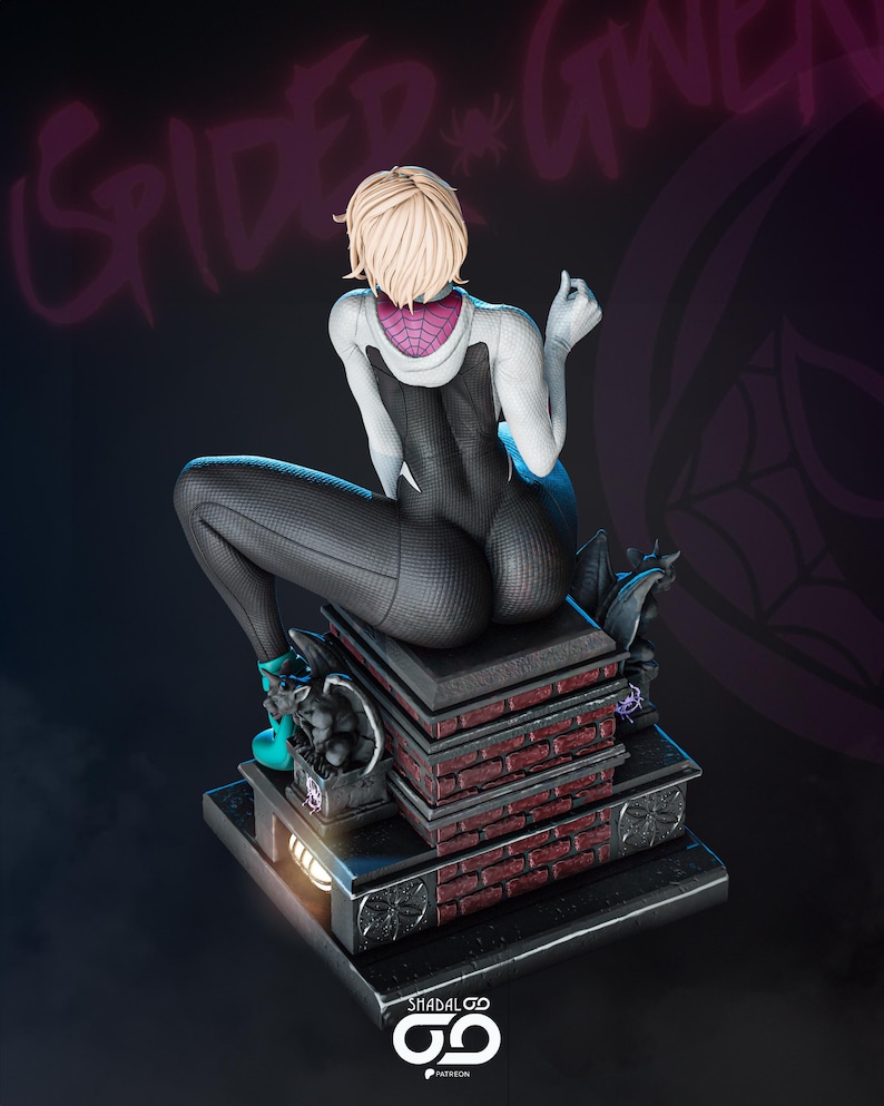 May include: A detailed statue of Spider-Gwen, featuring a blonde-haired figure in a black and white suit, seated atop a brick and stone base. The statue has a dynamic pose, with intricate detailing on the costume and base. The background is dark with the words "Spider-Gwen".