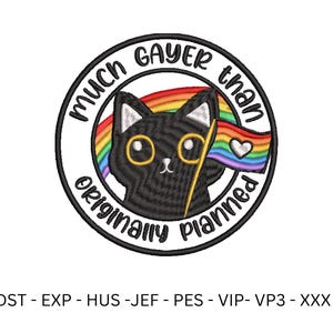 May include: A black cat with large yellow eyes and a rainbow flag, surrounded by a circular design with the text "Much Gayer Than Originally Planned". The design is a colorful and playful representation of LGBTQ+ pride.