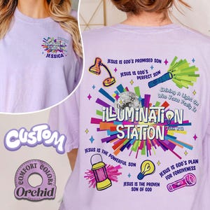 May include: Light purple t-shirt with the text "ILLUMINATION STATION" and various graphics. The shirt features a design on the front and back, including the name "JESSICA" and the words "JESUS IS GOD'S PROMISED SON".