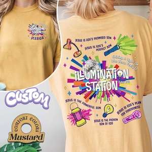 May include: Mustard-colored t-shirt with the text "ILLUMINATION STATION" and various graphics. The back of the shirt features additional text and illustrations, including a disco ball, a lamp, and a flashlight. The shirt also has the text "JESUS IS GOD'S PROMISED SON".