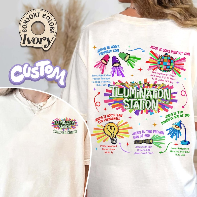 May include: Ivory-colored Comfort Colors t-shirt with a custom design. The design features the words "ILLUMINATION STATION" with religious graphics and text, including "Jesus is God's Promised Son" and "Jesus is God's Perfect Son."