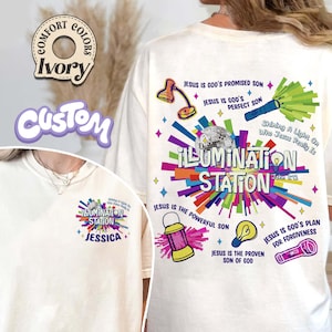 May include: Ivory-colored t-shirt with a colorful "ILLUMINATION STATION" graphic. The design includes illustrations of a lamp, disco ball, flashlight, lantern, lightbulb, and text: "Jesus is God's Promised Son", "Jesus is God's Perfect Son", "Shining A Light On Who Jesus Really Is", "Jesus is the Powerful Son", "Jesus is the Proven Son of God", and "Jesus is God's Plan for Forgiveness".