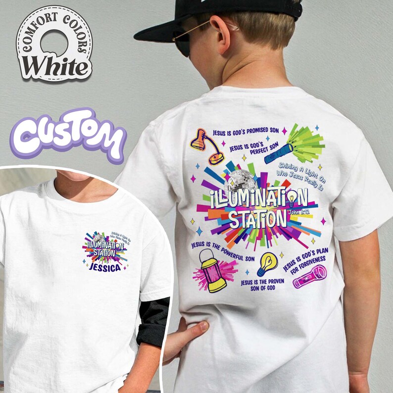 May include: White t-shirt with a colorful graphic design on the back that says "ILLUMINATION STATION" with various religious symbols and text. The front of the shirt has a smaller version of the design with the name "JESSICA".