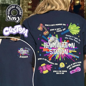 May include: Navy blue t-shirt with the text "ILLUMINATION STATION" and various graphics, including a disco ball, lamp, and light rays. The shirt also features the text "Shining A Light On Who Jesus Really Is".
