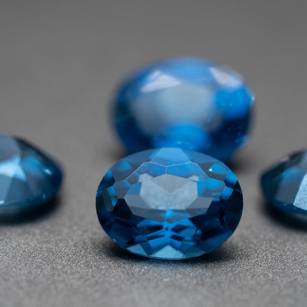 Oval Faceted Blue Ziron - (Synthetic Spinel) various sizes (1 piece)