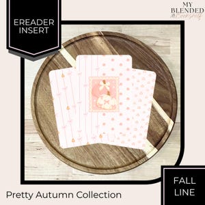 May include: Three rectangular ereader inserts featuring a light pink and white color palette. The designs include vertical stripes with small bows, a central stamp-style graphic of two pumpkins with bows, and a pattern of tiny pumpkins.