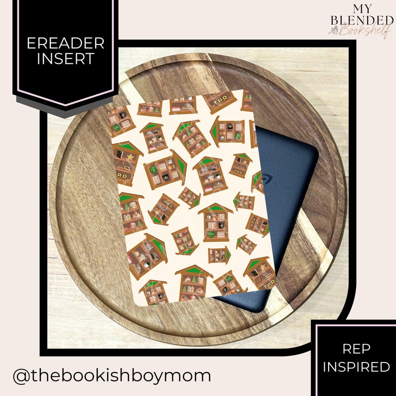 May include: An eReader insert with a repeating pattern of illustrated bookshelves on a cream background. The insert is placed on a wooden tray with a black eReader partially visible. Text on the insert reads "TBD" and "REP INSPIRED".