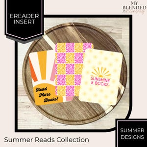 May include: Three eReader inserts with summer-themed designs rest on a wooden tray. One insert has orange and pink stripes with the text "Read More Books!". Another features a pink and yellow floral pattern. The third has a sunburst design and the text "Sunshine & Books".