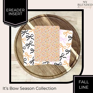 May include: Three rectangular ereader inserts featuring decorative patterns. The left and right inserts display black, orange, and pink bows on a white background. The center insert features a dense floral and bow pattern in orange, pink, and yellow.