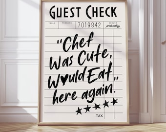 May include: A framed print with a beige background and black text that reads "GUEST CHECK" at the top. Below, the text says "Chef Was Cute, Would Eat here again." with five stars at the bottom.