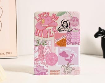 May include: A rectangular tablet case featuring a collage of pink and white graphics including cowboy hats, boots, disco balls, and the text Let's Go Girls, Howdy, and Howdy Y'all. The design incorporates various western-themed illustrations.