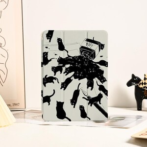May include: A black and white illustration of a bottle of ink with the word "Ink" on it, surrounded by black cats. The illustration is on a white background.