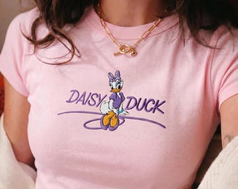 Camiseta de bebé con bordado de Daisy Duck, diseño adorable y divertido, perfecta para los fans de Disney, cómoda y elegante para el día a día.
