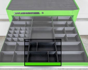 May include: A black tool organizer insert with multiple compartments, designed to fit inside a green and black tool chest drawer. The drawer is open, revealing the insert and other compartments.