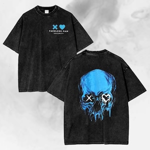 May include: Black t-shirt with a distressed wash. The front features a blue cross and heart graphic with the text "FACELSS MAN SECURITY". The back displays a blue skull design with dripping details and X and heart eyes.