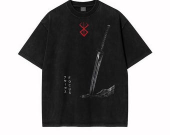May include: Black t-shirt with a red symbol and a sword graphic. The shirt has the word "FOCUS" and Japanese characters printed on it. The t-shirt is made of a soft material and has a vintage wash.