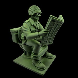 May include: A green figurine of a soldier sitting on a toilet, reading a newspaper. The soldier wears a helmet, glasses, and military uniform. The figurine is on a square base, with a black background.