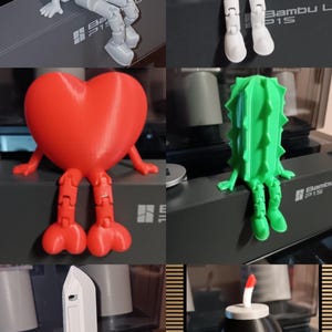 Puede incluir: Una colecci&oacute;n de figuritas impresas en 3D con diferentes formas, incluyendo un coraz&oacute;n, un cactus, un cuchillo, un huevo y una bomba. Cada figurita tiene un par de piernas y est&aacute; sentada sobre una superficie. Las figuritas est&aacute;n impresas en diferentes colores, incluyendo rojo, verde, marr&oacute;n, blanco y negro.