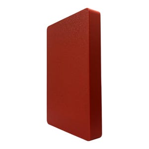 May include: A solid, rectangular object with a textured surface, presented in a vibrant shade of red. The object has rounded edges and a slightly angled perspective, showcasing its three-dimensional form against a white background.