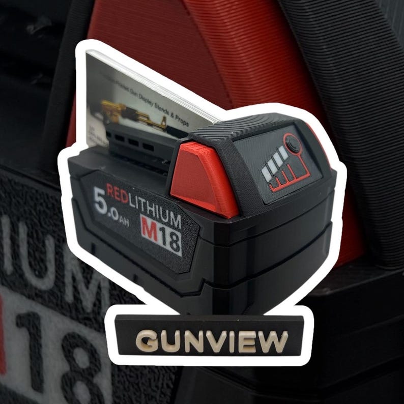 May include: A black and red lithium-ion battery with the text "REDLITHIUM M18 5.0Ah" on the side. The battery is sitting on a white stand with the text "GUNVIEW" on it.