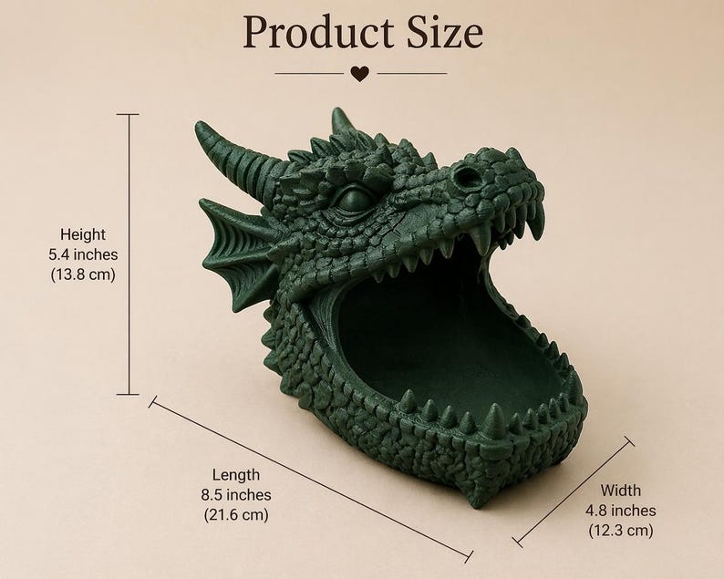 May include: A dark green dragon head-shaped container. The container is 5.4 inches (13.8 cm) high, 8.5 inches (21.6 cm) long, and 4.8 inches (12.3 cm) wide. The dragon has detailed scales, horns, and sharp teeth. The product size is displayed above the container.