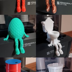 Puede incluir: Seis figuritas impresas en 3D con piernas y pies humanos. Las figuritas est&aacute;n sentadas sobre una superficie negra. Las figuritas tienen forma de manzana, pila de caca, pi&ntilde;a, inodoro, barril y cubo de basura. Las figuritas son de diferentes colores.