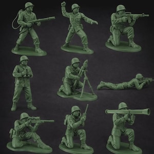 May include: A collection of nine green plastic toy soldiers in various action poses. Soldiers are depicted kneeling, aiming rifles, throwing grenades, and operating a mortar. Each figure is on a small green base.