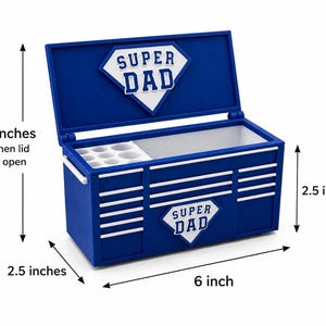 May include: A blue toolbox with white accents and the words "SUPER DAD" in a diamond shape. The toolbox is 6 inches long, 2.5 inches high, and 5 inches high with the lid open.