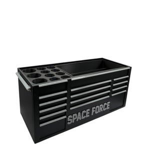 May include: Black tool chest with silver accents and the words "SPACE FORCE" in silver. The chest has multiple drawers and compartments for tool storage. It includes a section with circular holders.
