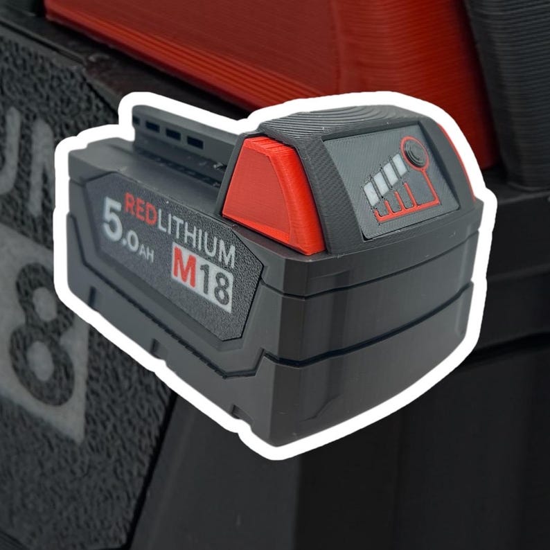 May include: A black and red power tool battery with the text "REDLITHIUM M18 5.0AH" on the side.