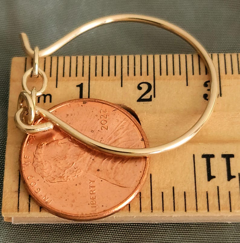 Large charm holder with chain on ruler and penny to show size.  Gold filled.