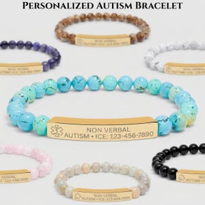 May include: Several beaded bracelets in various colors, including blue, brown, and black. Each bracelet features a gold-colored rectangular plate with the text "NON VERBAL AUTISM • ICE: 123-456-7890" and a medical symbol.