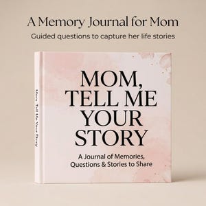 May include: A hardcover journal titled "Mom, Tell Me Your Story." The cover features a watercolor design with the title in large, bold letters. The journal is designed to capture memories, questions, and stories to share.