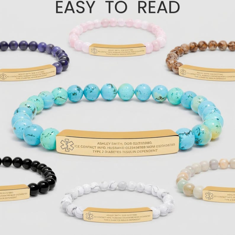 May include: A selection of beaded medical alert bracelets in colours such as blue, pink, and black. Each bracelet has a gold-tone metal plate with medical information and the text "EASY TO READ".
