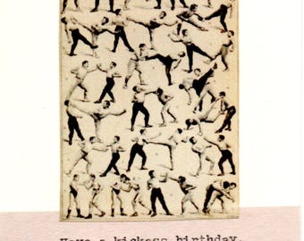 May include: A birthday card featuring a collage of black and white illustrations of figures in martial arts poses. The text "Have a kickass birthday" is printed in a simple font at the bottom of the card.