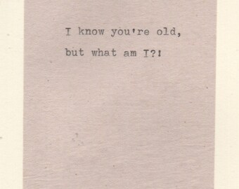 May include: A vintage-style card with the text "I know you're old, but what am I?" printed in black on a light beige background.