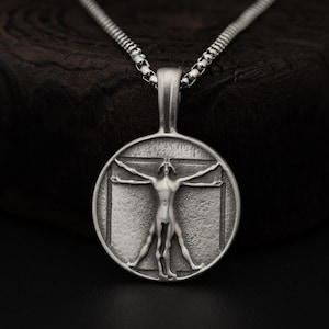 Naszyjnik z wisiorkiem Człowiek witruwiański, medalion z renesansowej geometrii da Vinci, biżuteria artystyczna z filozofią proporcji ludzkich, prezent intelektualny dla mężczyzn