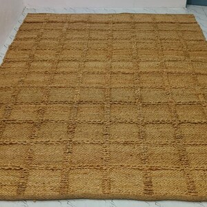 Corner shot of the rug showing weave density and handcrafted finish.