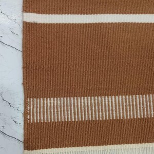 Outdoor setup showing the rug used on a patio or balcony space