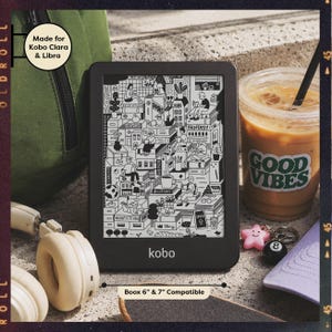 May include: A black Kobo e-reader featuring a screen with a detailed black and white line art illustration of people reading among stacks of books. The device has the text Made for Kobo Clara & Libra and Boox 6" & 7" Compatible printed on it.