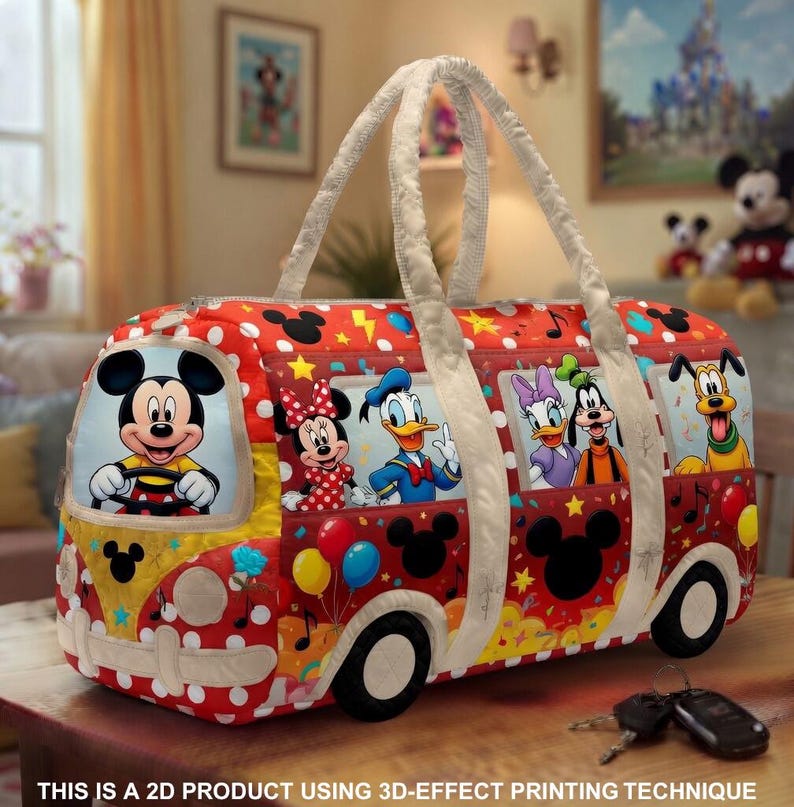 May include: A red and white polka-dotted travel bag with images of Mickey Mouse and friends in a bus design. The bag has white handles and black wheels. The text at the bottom reads: THIS IS A 2D PRODUCT USING 3D-EFFECT PRINTING TECHNIQUE.