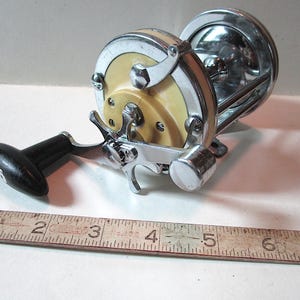 antique mitchell fishing reels 3 x 410A Vintage Carp Reels.  Vintage Carp Fishing Tackle Sold at Auction: 2- VINTAGE