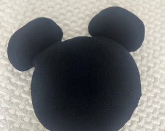May include: Black plush Mickey Mouse head with large ears.