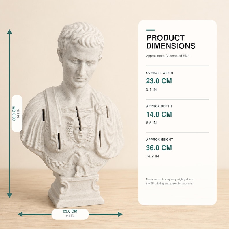 May include: A light gray bust of a Roman figure featuring a detailed chest plate with a central face and eagle emblem. The sculpture measures 36.0 cm or 14.2 inches in height, 23.0 cm or 9.1 inches in width, and 14.0 cm or 5.5 inches in depth.