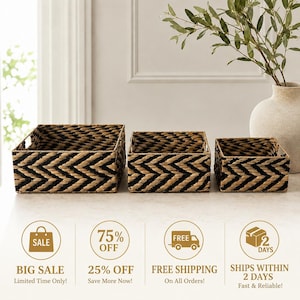 May include: A set of three rectangular storage baskets of varying sizes, each featuring a woven pattern of alternating black and natural tan fibers in a chevron design. The baskets have open tops and integrated side handles for easy carrying.